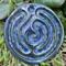 Blue Suede:
Royal blue ceramic finger labyrinth with metallic sparks, handmade for mindfulness and stress reduction. Exterior photo. 